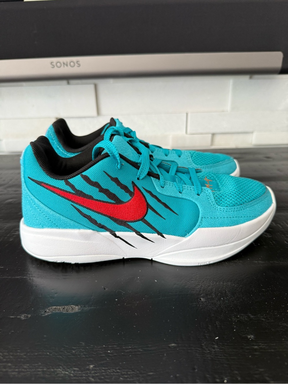 Nike Kids' Turquoise Sneakers with Red Swoosh and Black Accents